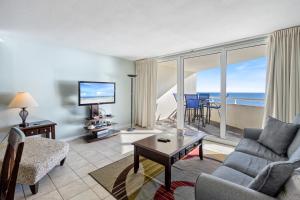 a living room with a view of the ocean at Perdido Sun Resort 704 By Pkrm in Pensacola