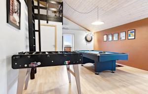 a billiard room with a blue table in it at Stunning Home In Strandby With Wifi in Strandby +23 photos