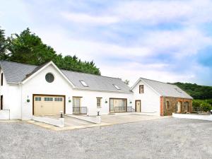 a white house with a garage at 3 bed in Narberth 36799 