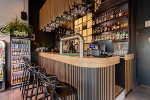 a bar with a faucet in a restaurant at Aparthotel City Break Wolska by INA in Warsaw