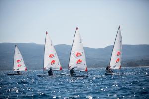 a group of three sailboats on a body of water at Neilson Messini Activity Beach Club in Kalamata