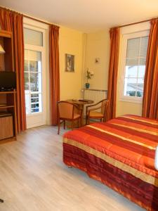 Postel nebo postele na pokoji v ubytování Hôtel La Caravelle