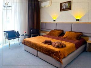 a bedroom with a large bed in a room at Karvan Sanatorium Naftalan in Naftalan