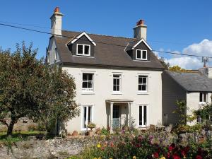 a white house with a black roof at 2 bed property in South Allington FERN3 in South Pool