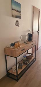 a wooden table with food on it in a room at Casa Isa in Almograve