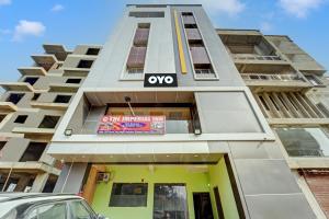 a tall building with a sign on it at OYO Flagship The Imperial Inn in Patna