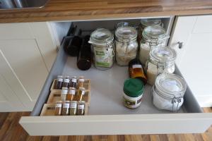 an open refrigerator drawer filled with jars and condiments at Auftanken im Grünen _ just4you_b.Berlin in Neuenhagen