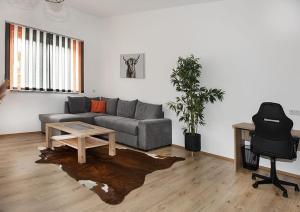 a living room with a couch and a table at Schindelbacherhof in Spielberg