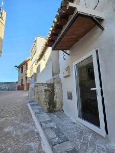 a white building with a door on the side of it at Casa el Mirador de Moratalla in Moratalla +22 photos