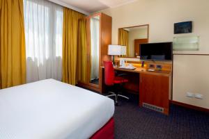 A bed or beds in a room at Crowne Plaza Venice East by IHG