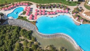 an aerial view of a resort with a pool at Anantara Mina Ras Al Khaimah Resort in Ras al Khaimah
