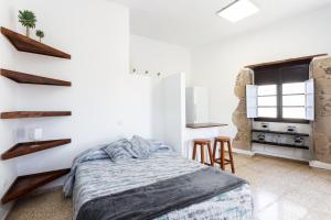 Postel nebo postele na pokoji v ubytování El Hostal del Cubo