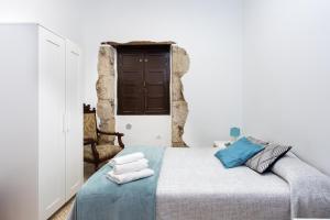 Postel nebo postele na pokoji v ubytování El Hostal del Cubo