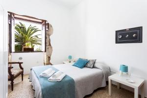Postel nebo postele na pokoji v ubytování El Hostal del Cubo