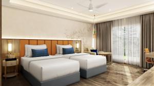 a hotel room with two beds and a table at Ekante Bliss Tirupati - IHCL SeleQtions in Tirupati
