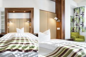 Postel nebo postele na pokoji v ubytování Hotel Alea City
