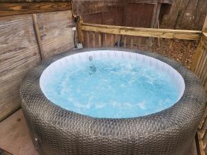 a jacuzzi tub in a wicker enclosure at Harmony Tree Resorts inc in Nashville
