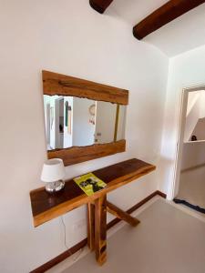 a mirror and a table in a room at Swan Lake Crystal Lagoon View Chalet in Hurghada
