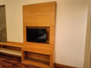 a living room with a flat screen tv on a wall at Holiday Inn Amritsar Ranjit Avenue, an IHG Hotel in Amritsar
