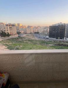 a view of a city from a window at Apartment in Amman 7th circle in Amman