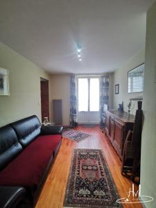 A seating area at L appartement du chalet rose