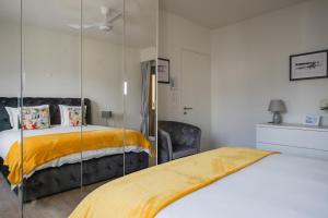 a bedroom with a bed and a glass wall at RELAX Ortensia Apartment in Locarno