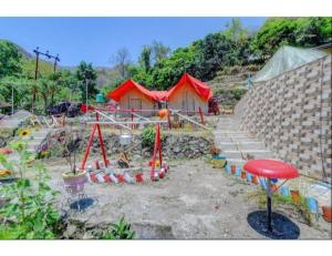 a construction site with red tents in a yard at Aqua Splash Camp, Rishikesh in Rishīkesh