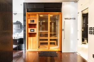 a door to a store with a sign that reads welltrust at Luxury appartment 250mt for lovers in Rome