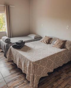 Uma cama ou camas num quarto em Hostel Network - Quartos Privativos