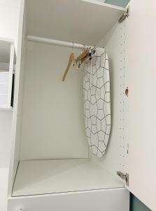 a bathroom with a white closet with a toilet in it at Charmant studio neuf proche de paris in Bagnolet