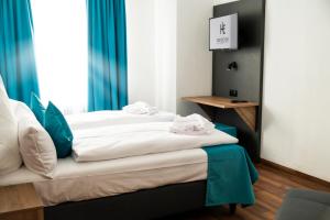 Postelja oz. postelje v sobi nastanitve Hotel Hansa Stuttgart City