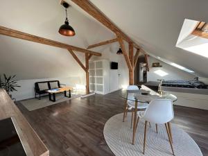 a living room with a couch and a table at Schönes Appartement mit Seeblick in Gummersbach