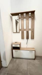 a bathroom with a sink and a mirror on a wall at Comfort Place Brno Apartments in Brno