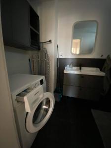 a small bathroom with a toilet and a sink at Bratislava FORESTPARK, FREE parking, self-check IN in Bratislava