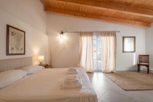 Postel nebo postele na pokoji v ubytování Dimoras Dimore Esclusive + 52 fotografií