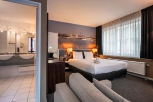 Postel nebo postele na pokoji v ubytování Hotel Docklands