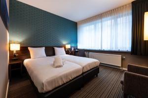 Postel nebo postele na pokoji v ubytování Hotel Docklands Antwerpen