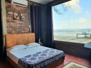 Postel nebo postele na pokoji v ubytování ALA Beach Lodge - Rhu Homestay