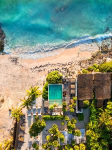 an aerial view of a beach with a pool at Our Habitas Tulum in Tulum