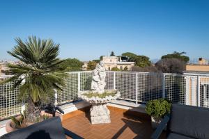 a balcony with a view of a building at Savoia Luxury Penthouse in Rome