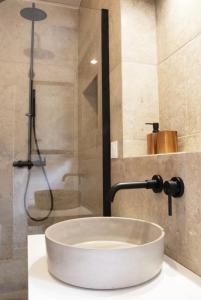 a bathroom with a sink and a shower at Casa Ghjuvan Matteu 