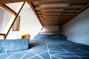 a bedroom with a bed in a attic at 3 Fishery Cottages - 2 Bedroom house close to town in Bundoran