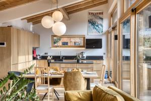 a kitchen and dining room with a table and chairs at Chalet 124 in Chamonix