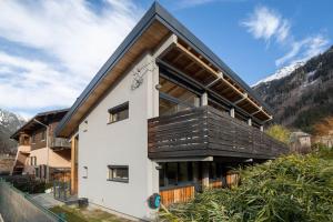 a house with a black roof at Chalet 124 in Chamonix