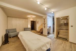 a hotel room with a bed and a living room at Chalet 124 in Chamonix