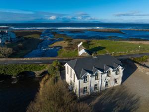 an aerial view of a house next to a river at 3 Fishery Cottages - 2 Bedroom house close to town in Bundoran