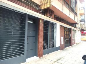 a pair of garage doors on the side of a building at Oasis Suites Fernando IV in Seville