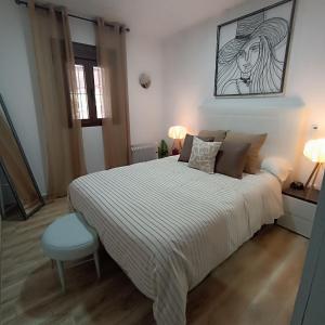 מיטה או מיטות בחדר ב-Alojamiento Rural Mariola