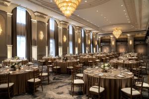 a ballroom with tables and chairs in a room with windows at The Westin Book Cadillac Detroit in Detroit