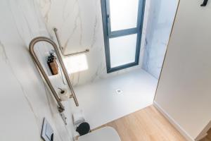 a bathroom with a sink and a mirror at Hotel Málaga Vibes in Málaga